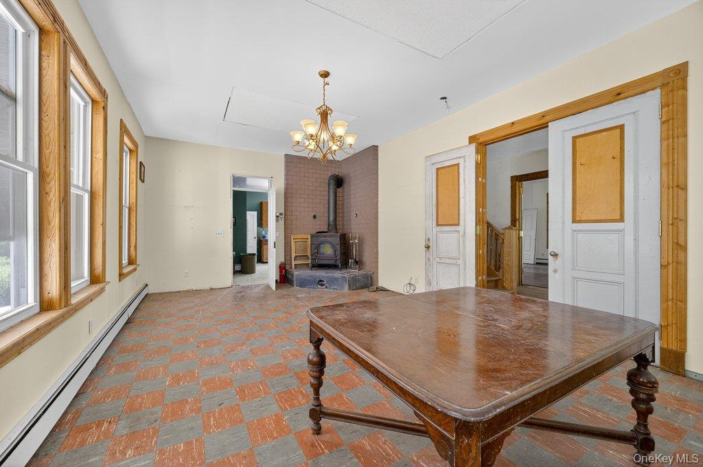 37 Little Road Wurtsboro, NY 12790 - Photo 6 of 24 wooden floor with a chandelier