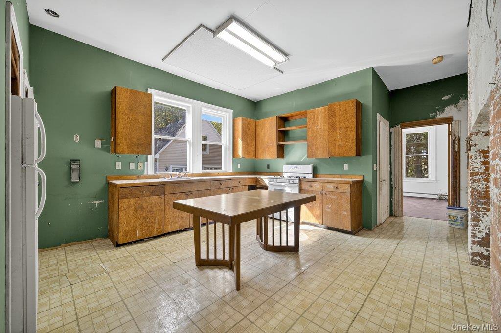 37 Little Road Wurtsboro, NY 12790 - Photo 8 of 24 a kitchen with granite countertop a sink a counter top space and stainless steel appliances