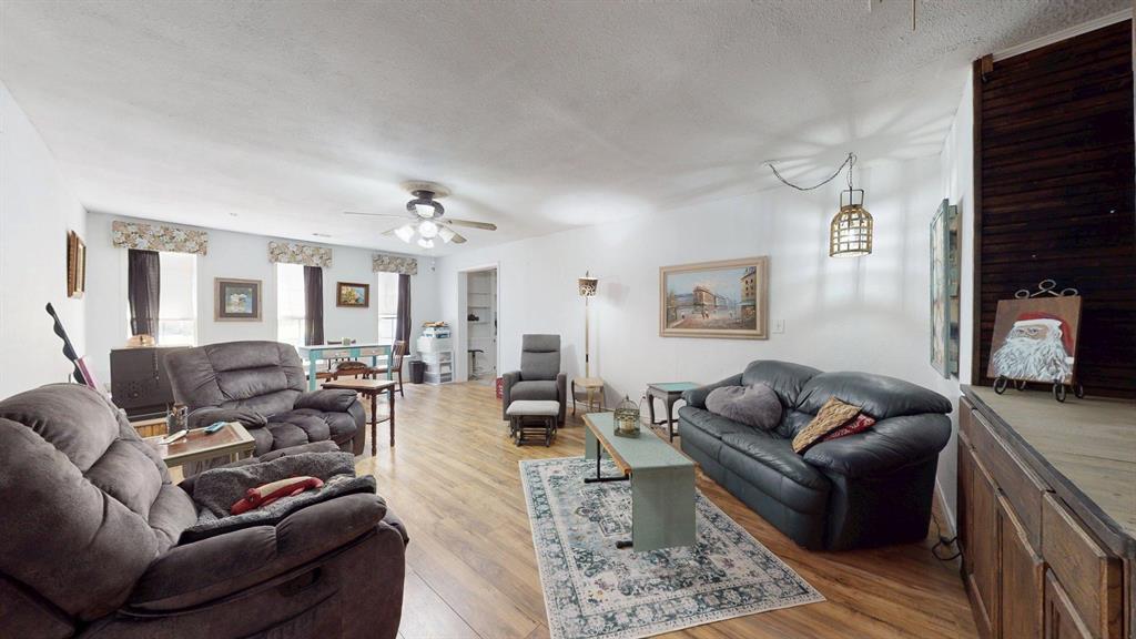 15415 Thunder Road Terrell, TX 75161 - Photo 6 of 21 a living room with furniture a fireplace and a couch
