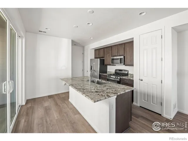 a kitchen with a counter top space and appliances