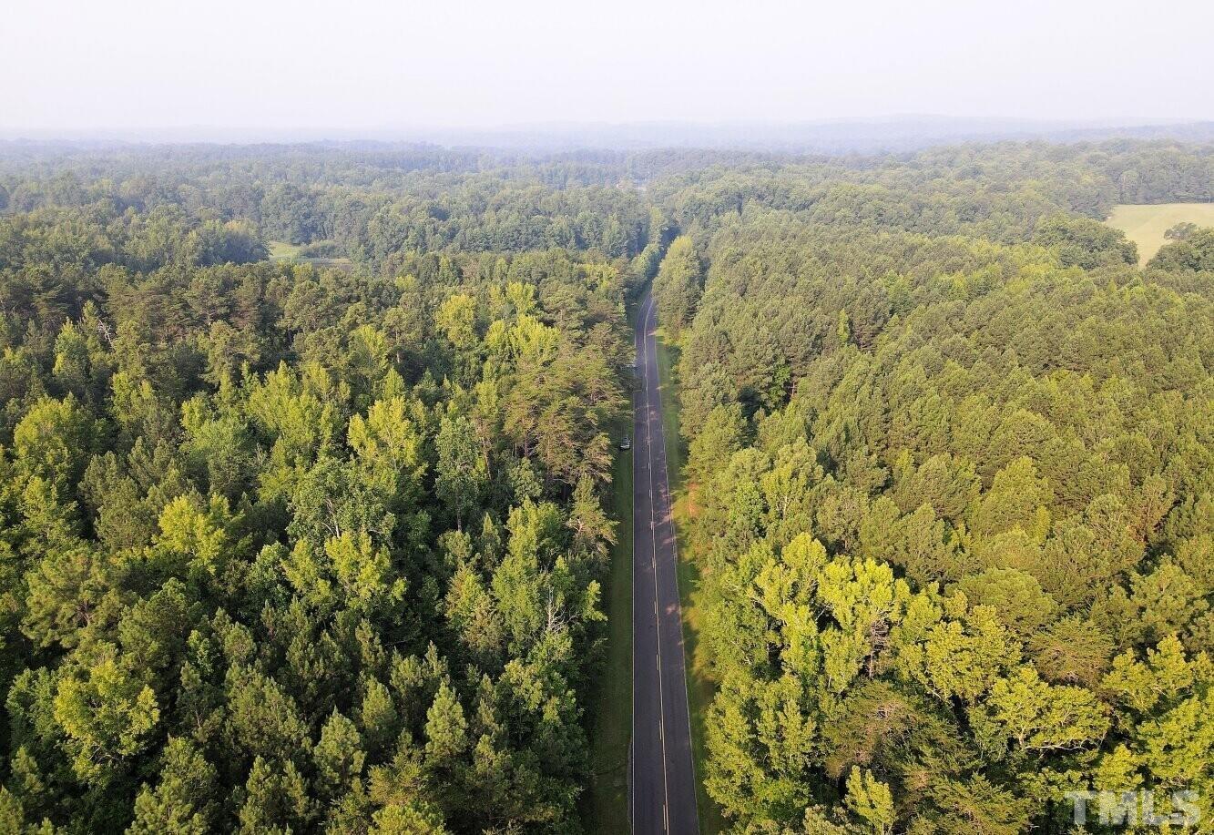 4097 Hall Rougemont, NC 27572 - Photo 4 of 12 a view of a city with lush green forest