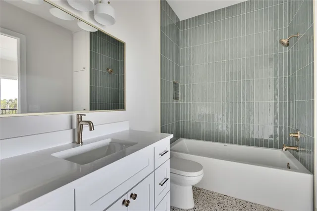 a bathroom with a sink a toilet and bathtub