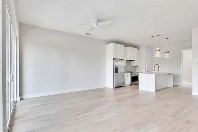 a view of kitchen with wooden floor