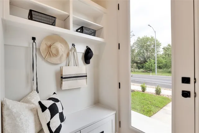 a picture of a room with wooden floor and windows