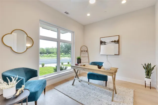 a work room with furniture and a window