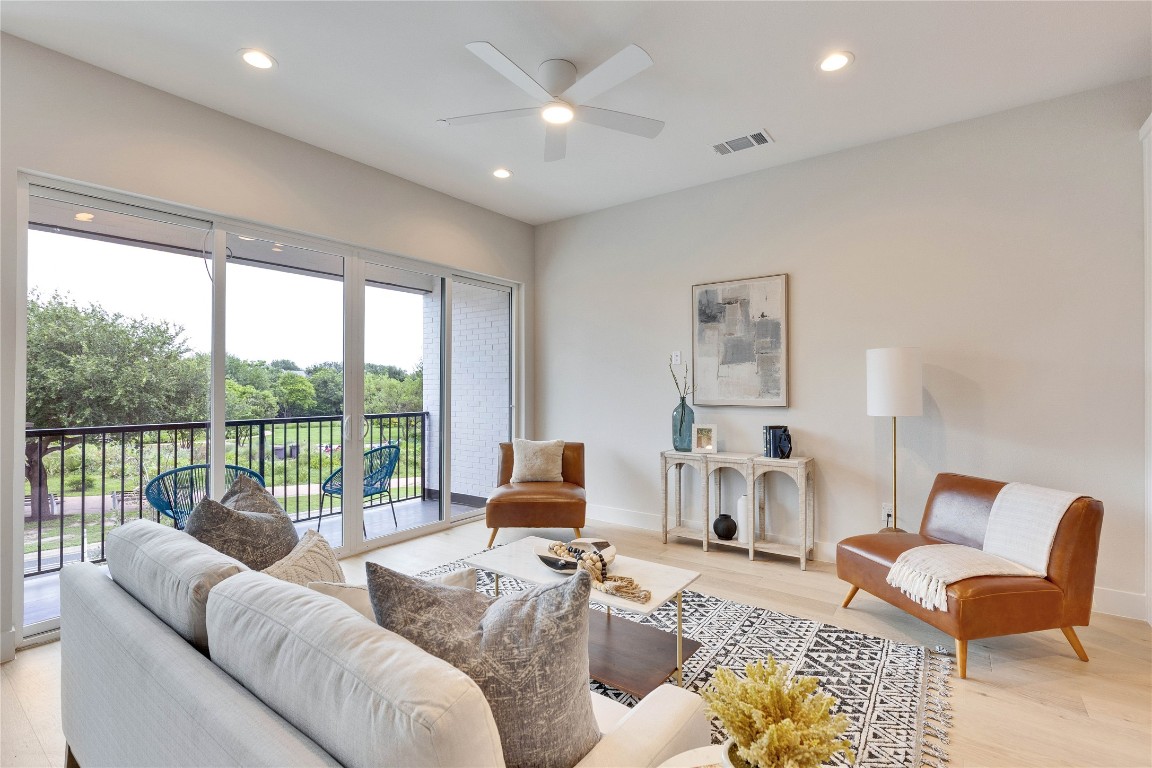 1937 East 38th 1/2 Street, Unit A Austin, TX 78723 - Photo 5 of 26 a living room with furniture and a large window