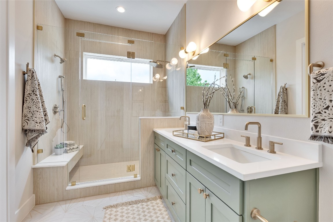 1937 East 38th 1/2 Street, Unit A Austin, TX 78723 - Photo 9 of 26 a bathroom with a sink a toilet and shower