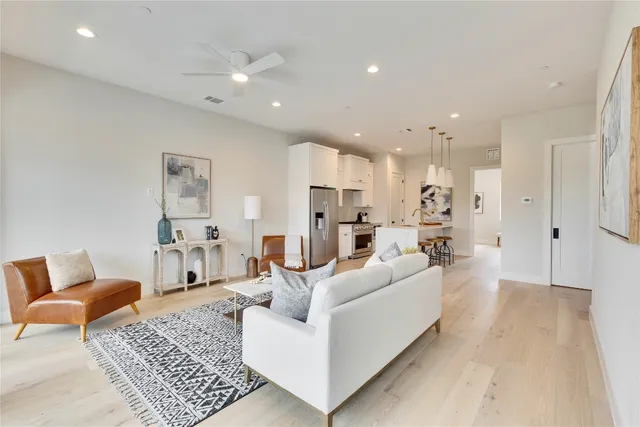 a living room with furniture and a rug