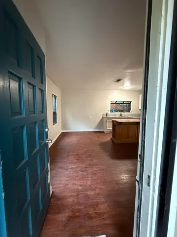 a view of kitchen and wooden floor