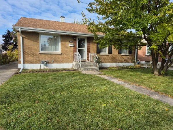 a front view of house with yard