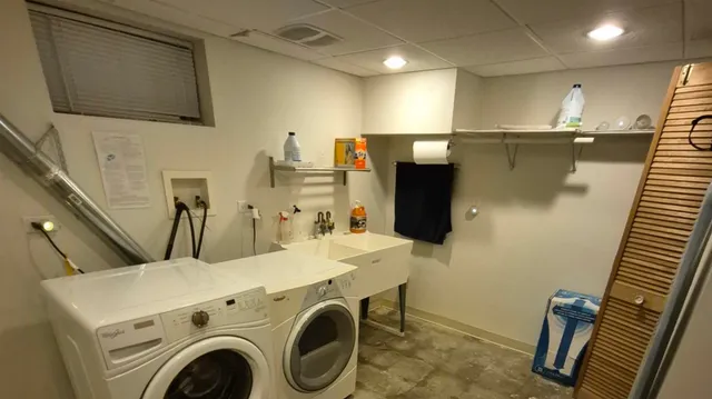 a utility room with dryer and washer