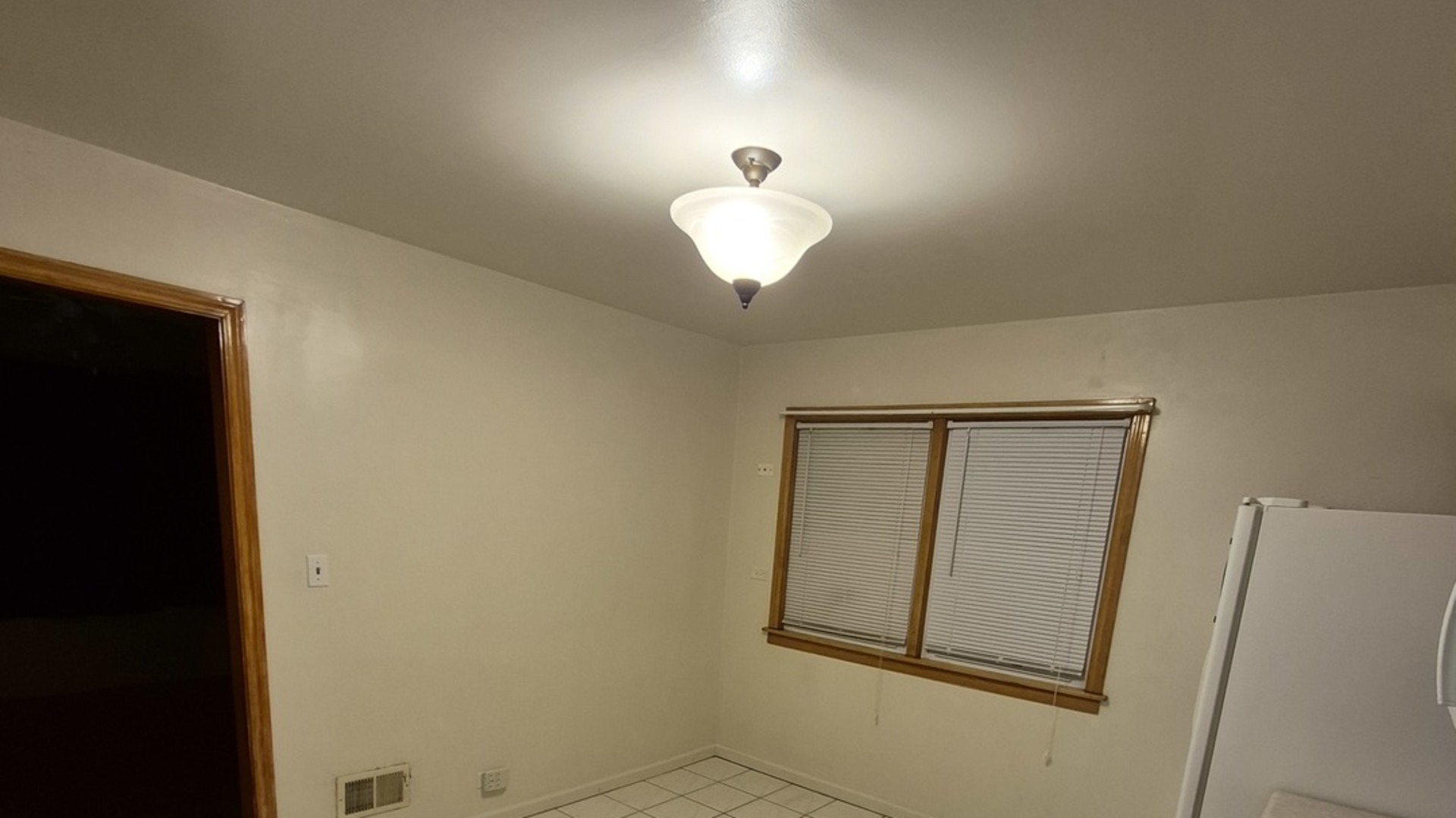 1224 North Irving Avenue Berkeley, IL 60163 - Photo 2 of 25 a lamp on the door in a room