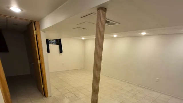 a bathroom with a shower and a glass door