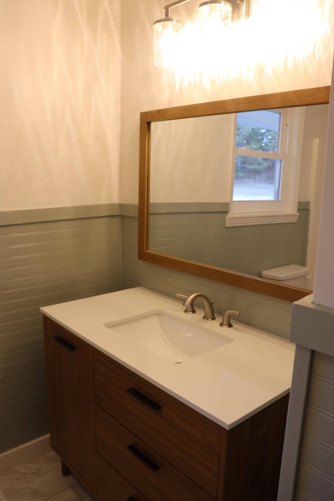 2224 Feddie Davis Road Ramer, TN 38367 - Photo 21 of 24 a bathroom with a sink vanity and a mirror