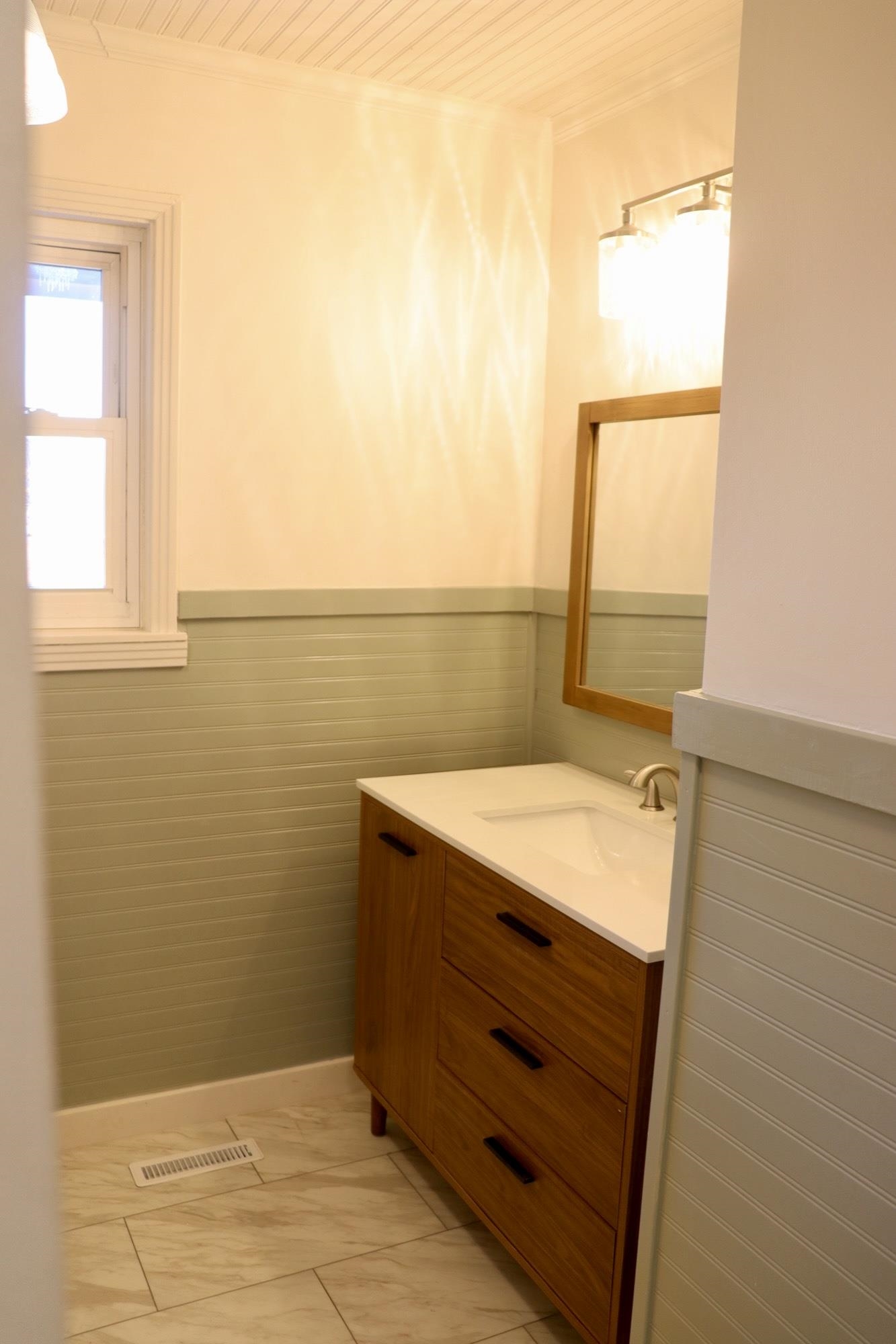 2224 Feddie Davis Road Ramer, TN 38367 - Photo 7 of 24 a bathroom with a sink a vanity and a window