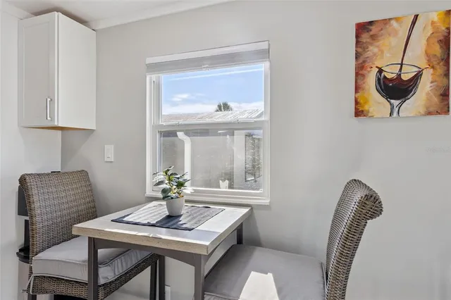 a dining room with furniture and window