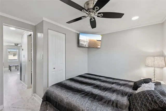 a bedroom with a bed and a lamp