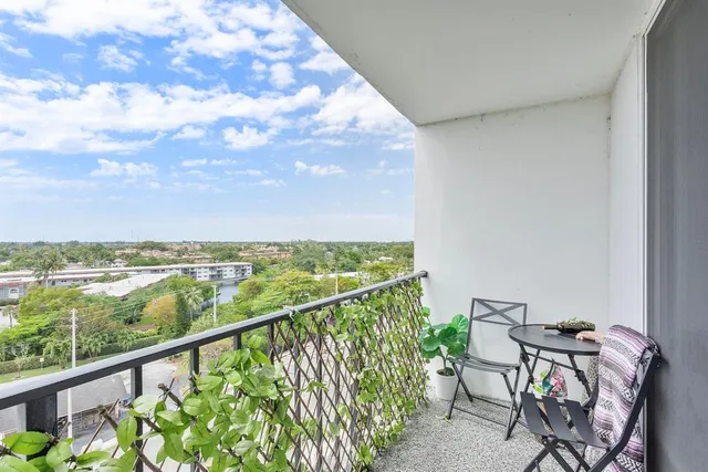 a view of a balcony with furniture