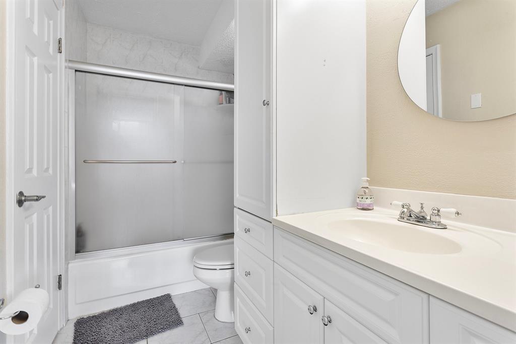1800 North Andrews Avenue, Unit 9I Fort Lauderdale, FL 33311 - Photo 14 of 36 a bathroom with a sink a toilet and a mirror