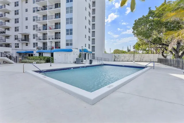 a view of a building with a swimming pool