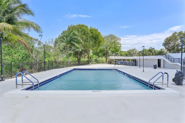 a view of a patio with a table and chairs