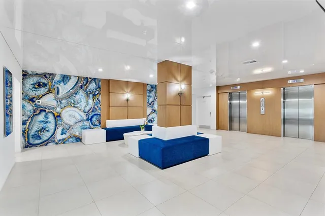 a lobby with furniture and a couch