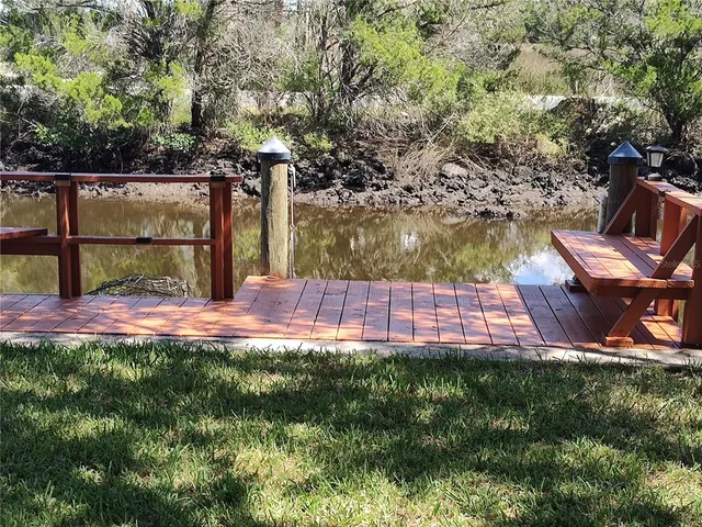 a view of a backyard with sitting area