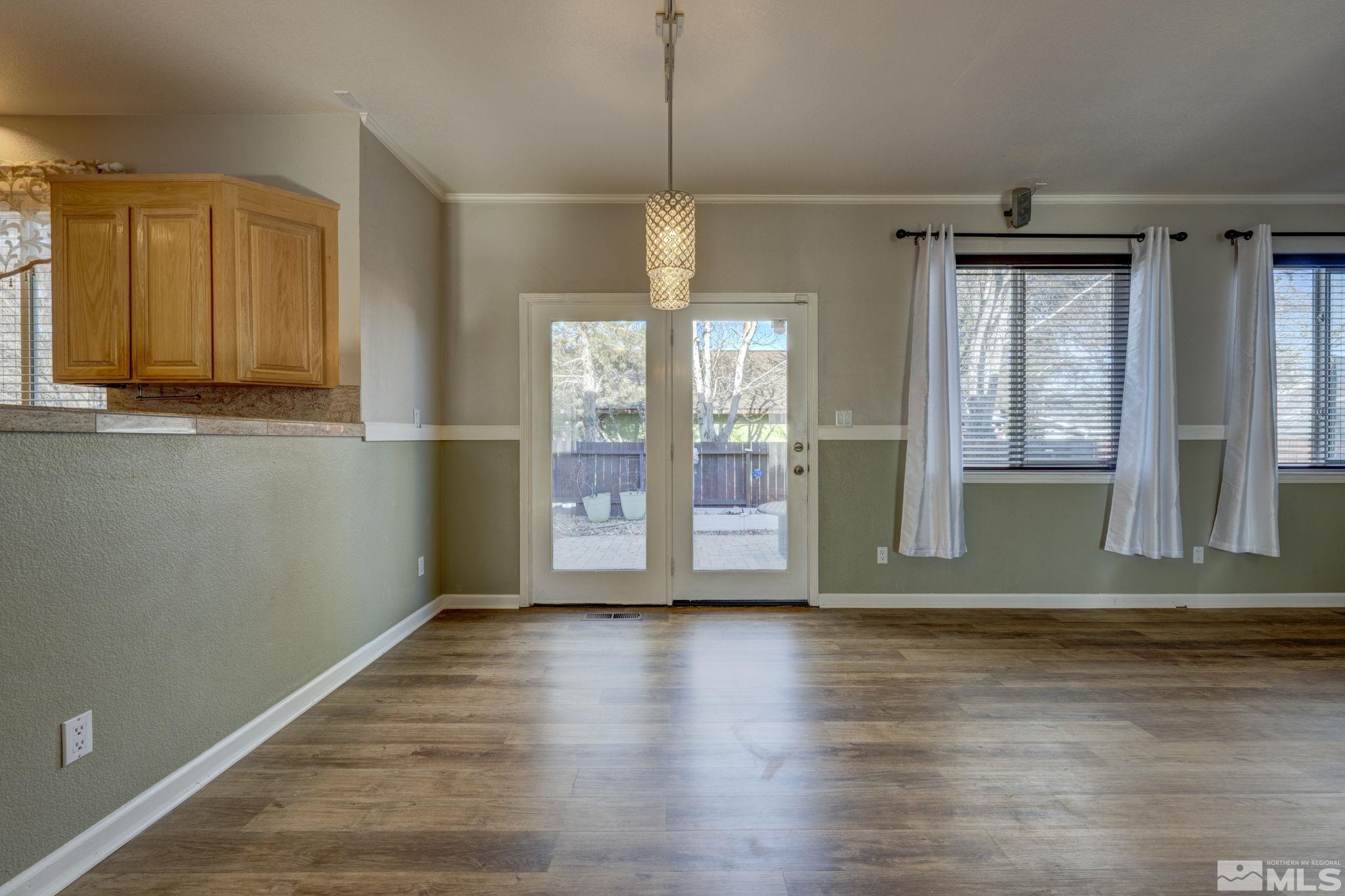 580 Creighton Way Reno, NV 89503 - Photo 14 of 40 a view of a room with wooden floor and windows