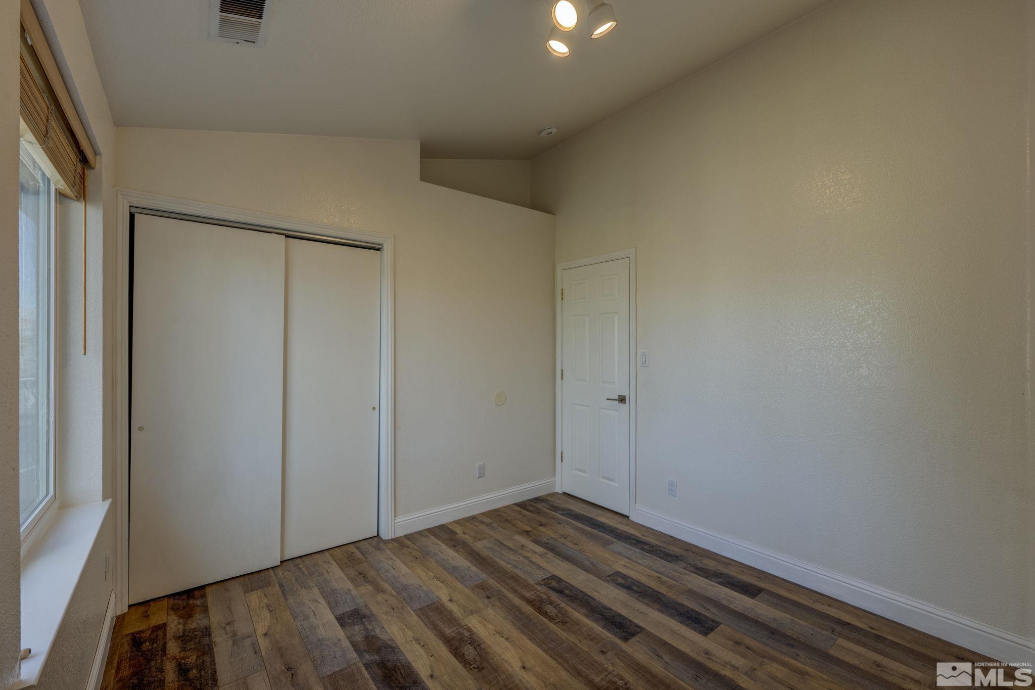 580 Creighton Way Reno, NV 89503 - Photo 27 of 40 a view of room with wooden floor