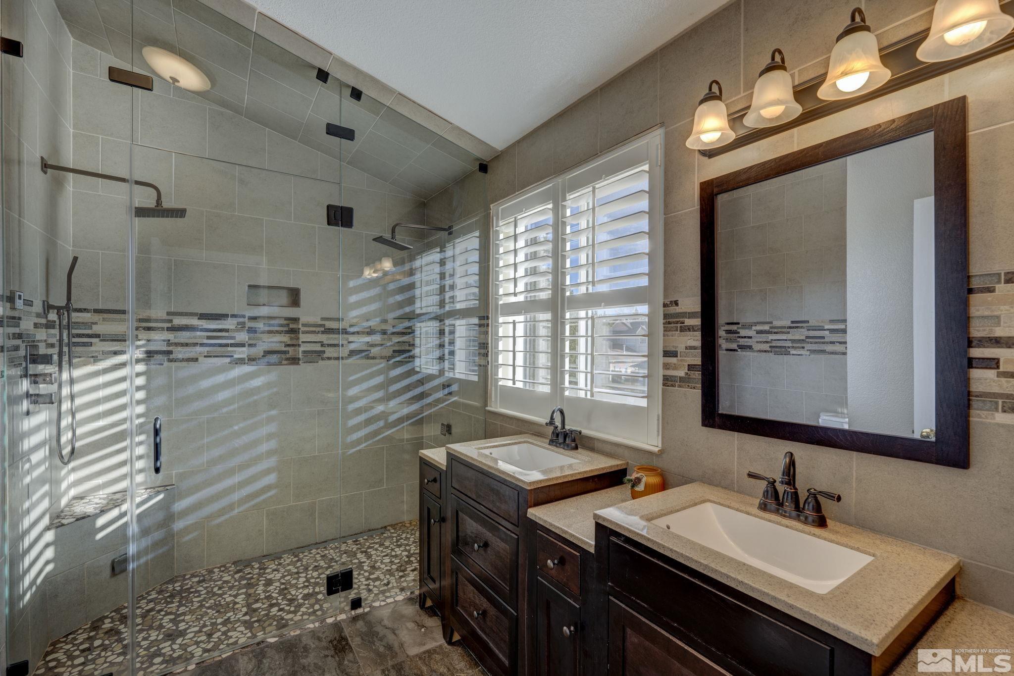 580 Creighton Way Reno, NV 89503 - Photo 36 of 40 a bathroom with double vanity and a mirror
