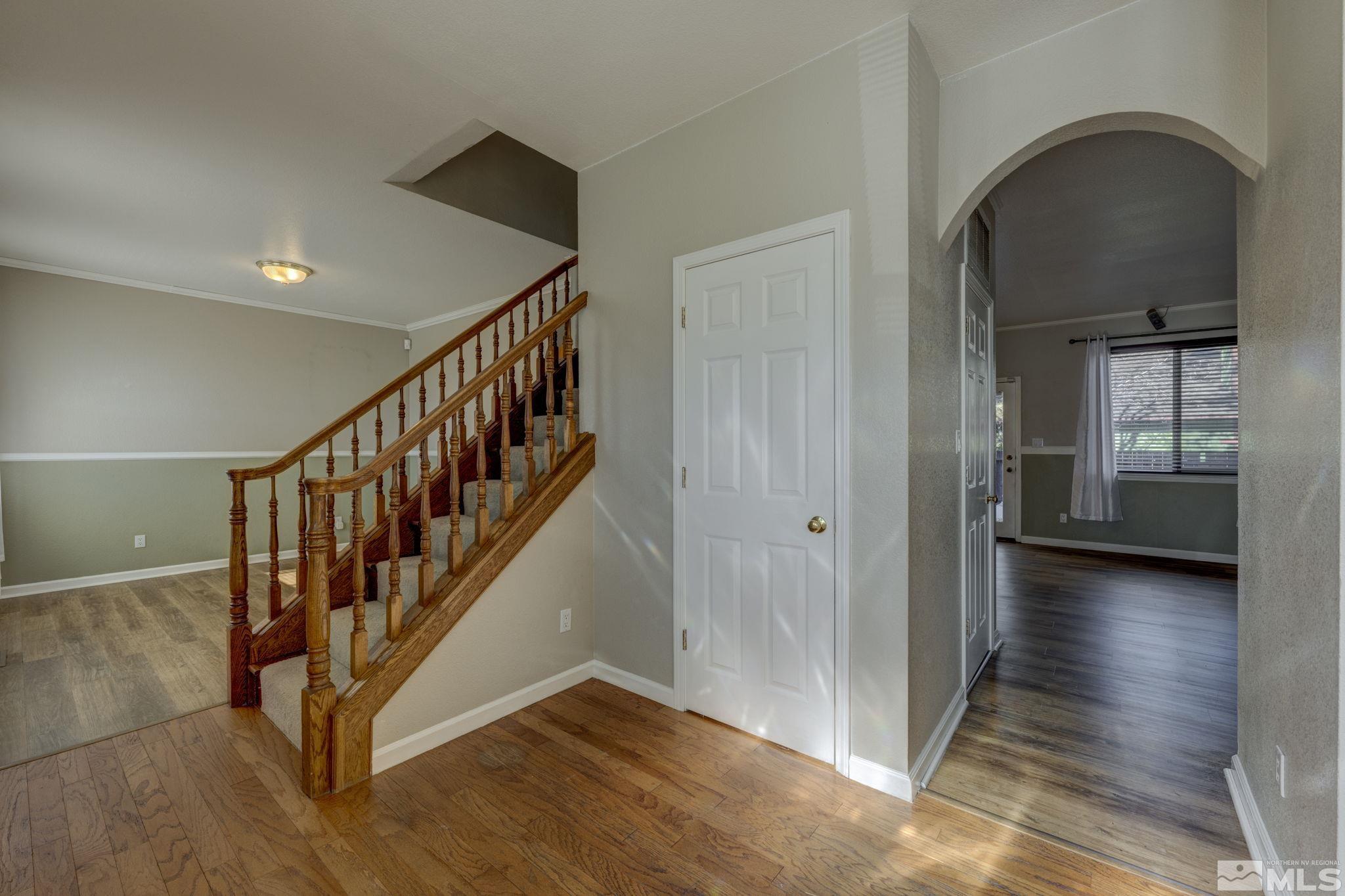 580 Creighton Way Reno, NV 89503 - Photo 8 of 40 a view of an entryway with wooden floor and door