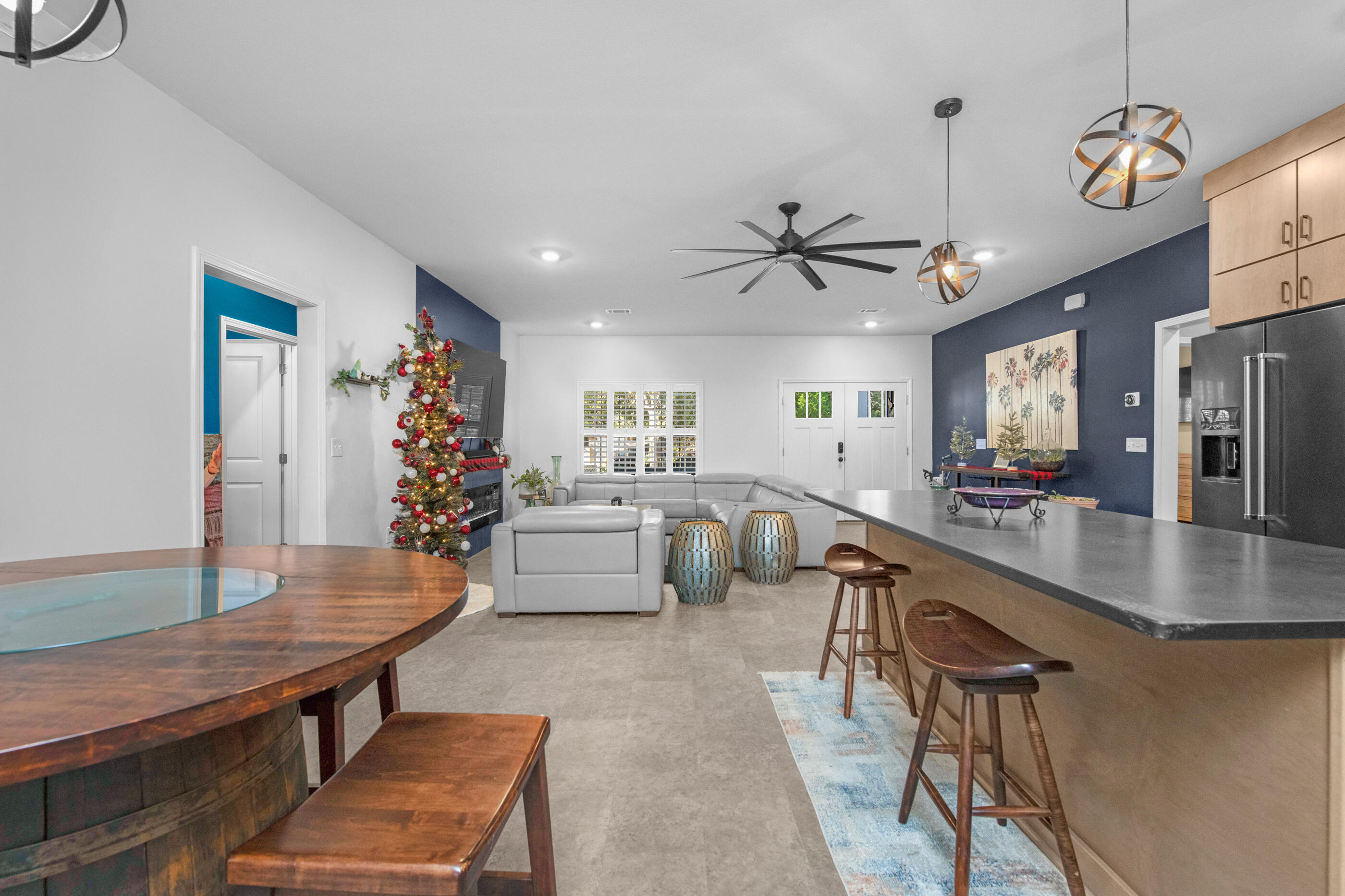 342 Eastern Street Freeport, FL 32439 - Photo 22 of 77 a living room with furniture kitchen view and a chandelier