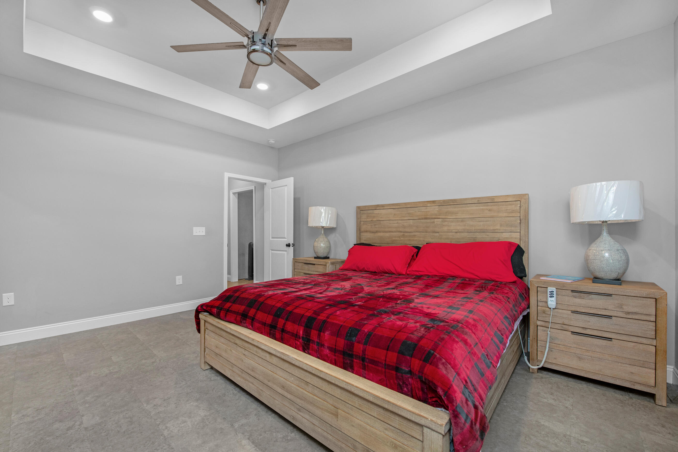 342 Eastern Street Freeport, FL 32439 - Photo 25 of 77 a bedroom with a bed and a ceiling fan