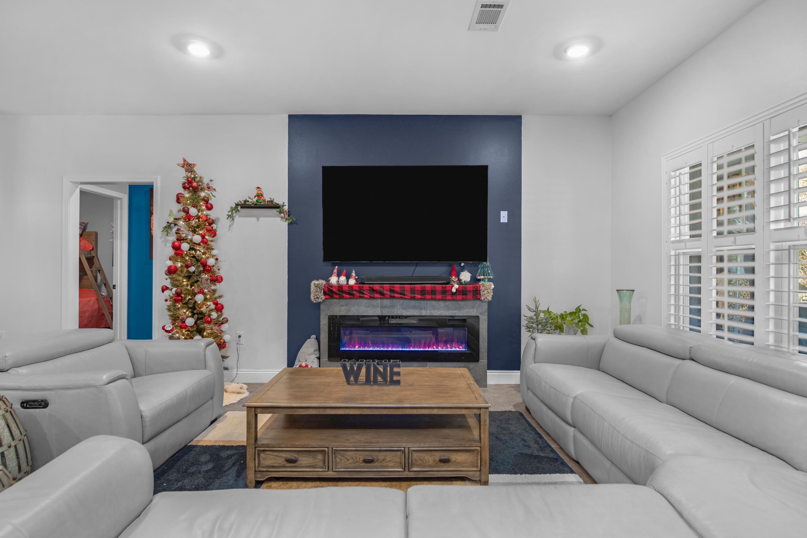 342 Eastern Street Freeport, FL 32439 - Photo 5 of 77 a living room with furniture and a flat screen tv