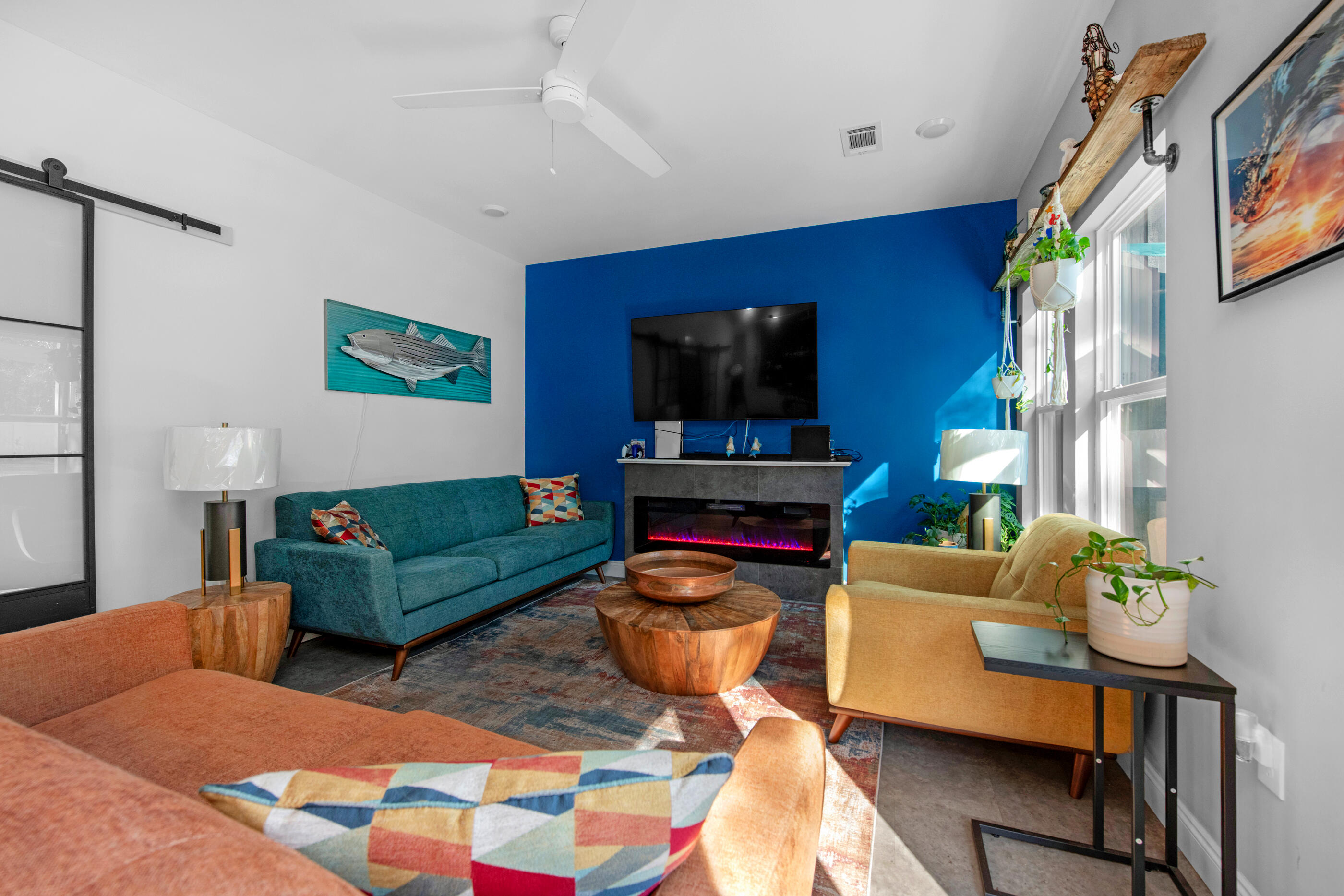 342 Eastern Street Freeport, FL 32439 - Photo 55 of 77 a living room with furniture a flat screen tv and kitchen view