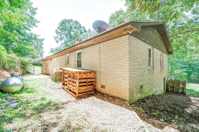 a backyard of a house with potted plants