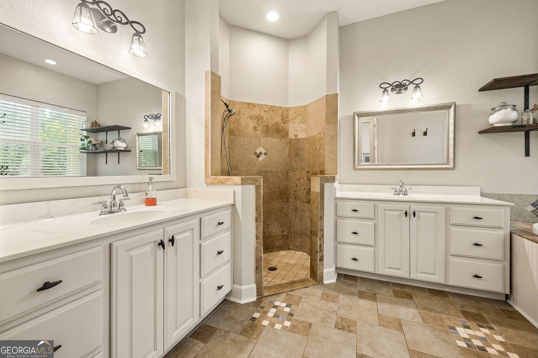 706 Hopewell Point Road White Oak, GA 31568 - Photo 34 of 84 Designed for comfort and convenience, the primary bath offers dual vanities, a walk-in shower, soaking tub, and generous storage throughout.