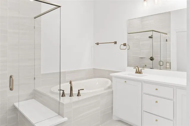 a view of an empty room with a window and fireplace