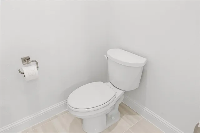 a view of an empty room and a bathroom