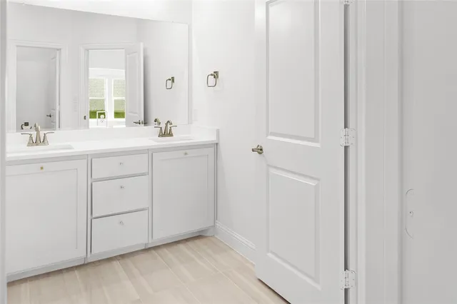 a bathroom with a bathtub and a sink