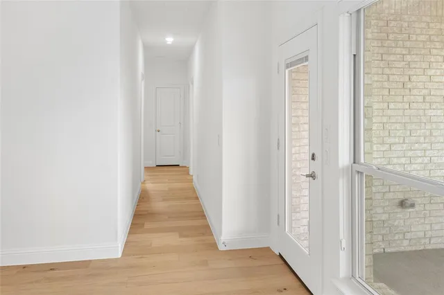 a spacious bathroom with a double vanity sink and mirror