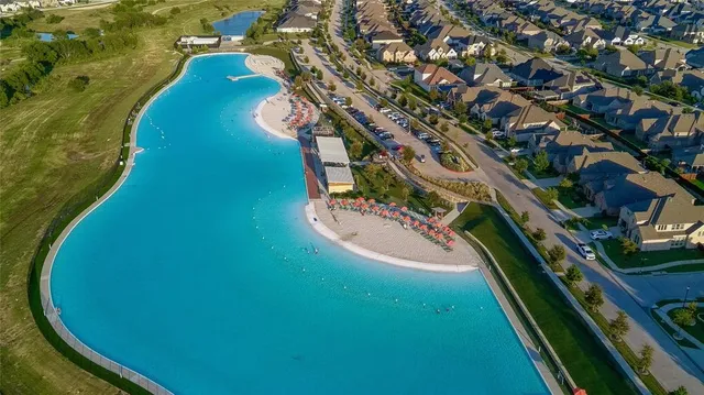 an aerial view of a residential houses with outdoor space