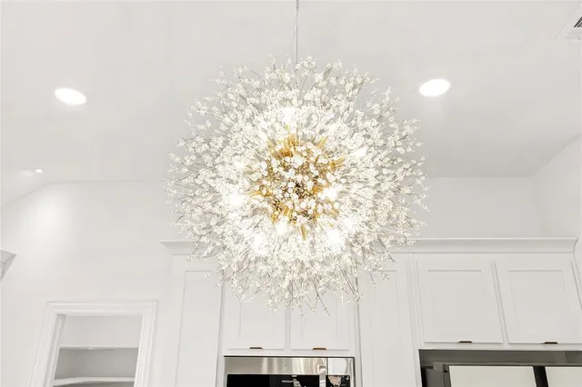 a view of a kitchen with stainless steel appliances refrigerator oven