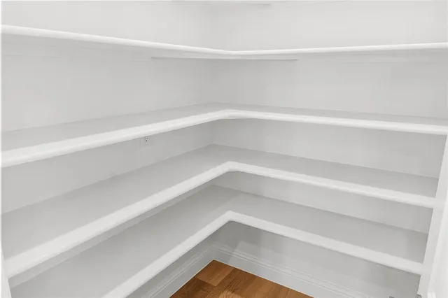 a kitchen with stainless steel appliances a stove and a microwave