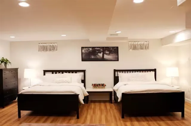 a bed room with a bed and night stand