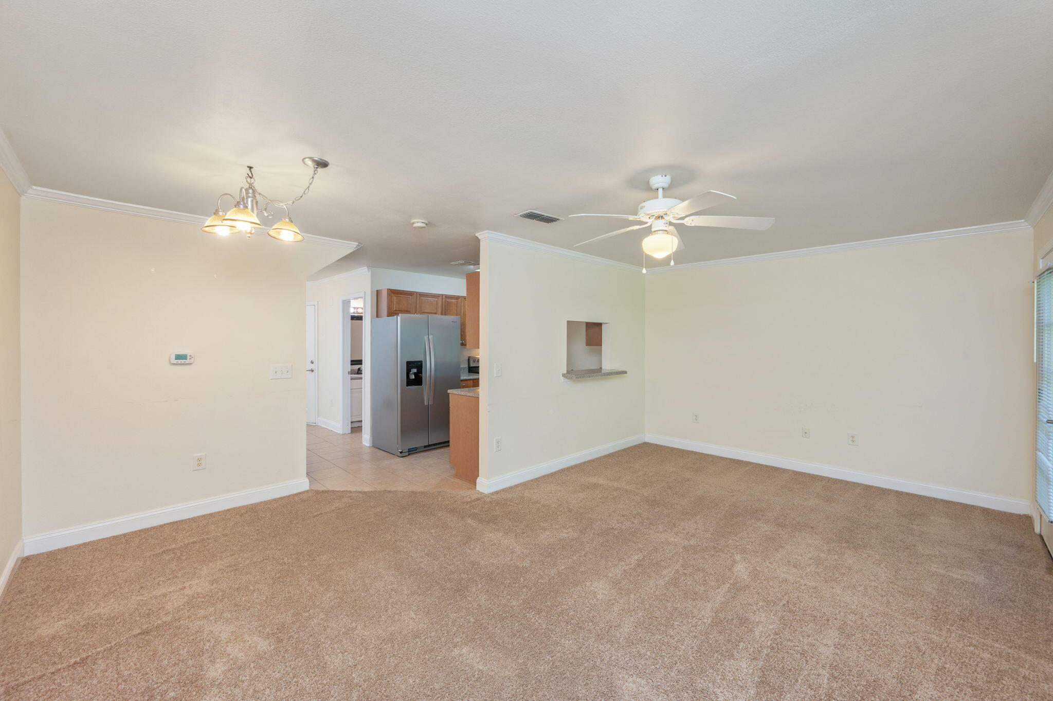 535 Wingspan Way Crestview, FL 32536 - Photo 1 of 26 a view of a livingroom with a ceiling fan