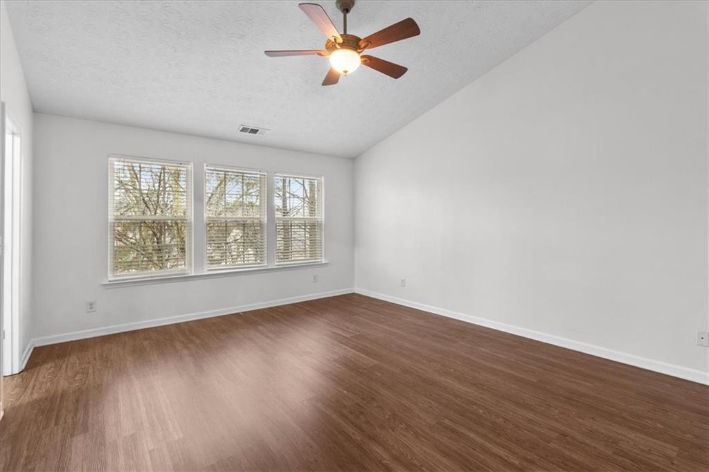 307 Meadows Lane Canton, GA 30114 - Photo 16 of 33 wooden floor in an empty room with a window