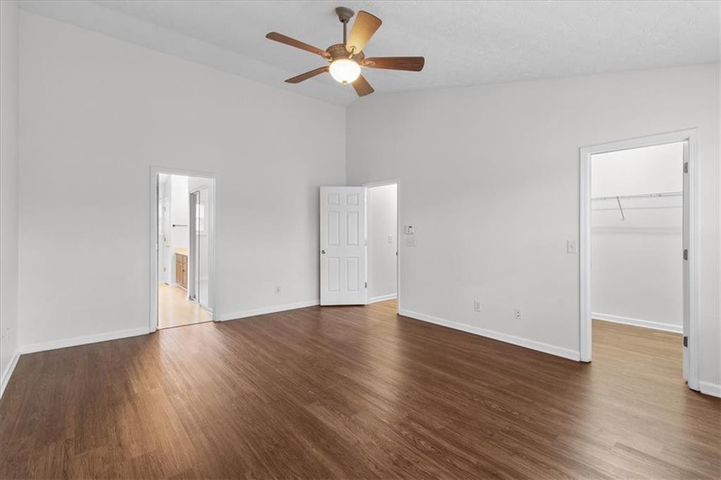 307 Meadows Lane Canton, GA 30114 - Photo 17 of 33 a view of an empty room with wooden floor