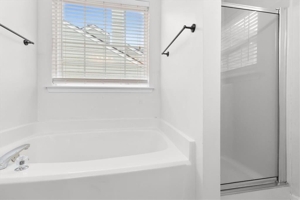 307 Meadows Lane Canton, GA 30114 - Photo 21 of 33 a bathroom with a bathtub