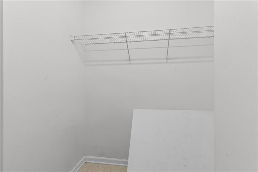 307 Meadows Lane Canton, GA 30114 - Photo 22 of 33 a view of a room with racks on the wall